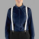 a person wearing suspenders and a blue shirt