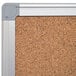 A MasterVision cork board with an aluminum frame and gray trim.