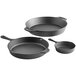 A group of three Valor pre-seasoned cast iron skillets of different sizes.