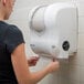 a white toilet paper dispenser