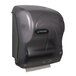 A San Jamar black pearl hands free paper towel dispenser.