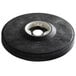 A black round object with a white circle in the center.