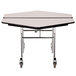 A white hexagonal cafeteria table with wheels and a black T-molding edge.