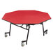 A red octagonal table with black metal legs.