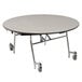 A round National Public Seating cafeteria table with wheels and a black edge.