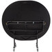 A black oval National Public Seating cafeteria table with wheels.