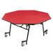 A red octagonal table with chrome legs.