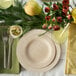 A table setting with a Bambu Veneerware plate, knife, and fork.