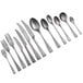 Several Oneida Lexia stainless steel demitasse spoons.