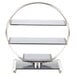 A Bon Chef stainless steel and glass wheel display stand with three glass shelves in a metal frame.
