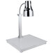 A silver and black Bon Chef carving station lamp on a white marble base.