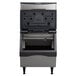 A black and silver Scotsman air cooled ice machine on a counter with the door open.