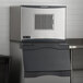 A Scotsman air cooled small cube ice machine with a storage bin.