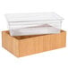 A clear plastic container in a bamboo ice housing.