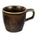 A brown espresso cup with a handle.