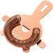 A copper-plated metal Barfly Hawthorne strainer with a spiral.