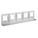 A metal shelf with five holes for holding tongs.
