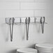 A stainless steel Edlund Smart Tong holder on a white background.