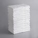A stack of white Lavex bath towels.