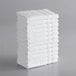 A stack of white Lavex washcloths.