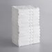 A stack of white Lavex bath towels.