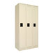 A sand-colored Tennsco steel locker with three doors and black rectangular handles.