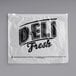 A white HDPE plastic deli saddle bag with "Deli Fresh" printed on it.