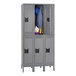 A grey Tennsco steel double tier locker with two doors, legs, and a coat rack.