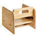 A Lancaster Table & Seating wooden booster seat with a natural finish.