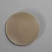 Edlund round cellophane patty paper with a circle in the middle.