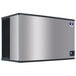 A silver rectangular Manitowoc Indigo NXT air cooled ice machine with black edges.