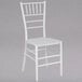 A white Flash Furniture resin chiavari chair with a cushion.