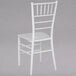 A white Flash Furniture Hercules Series Chiavari chair with a back.