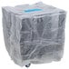 A large plastic wrapped box with wheels and dividers inside.