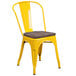 A yellow metal chair with a Flash Furniture wooden seat.