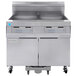 A Frymaster gas floor fryer with two drawers and two doors.