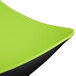 A close up of a lime green Brasilia melamine bowl with a black rim.