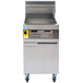 A Frymaster Decathlon natural gas floor fryer with a stainless steel top.