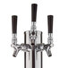 A silver Avantco beer tap with three black faucet handles.