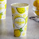 a cup with lemons on it