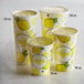 a group of cups with lemons on them