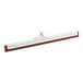 A red Carlisle floor squeegee with a white plastic frame.