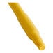 A yellow Carlisle fiberglass broom/squeegee handle.