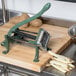 A Choice Prep French Fry Cutter on a cutting board with potatoes.