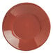 A round red porcelain bowl with a black rim.