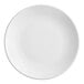 a white plate with a black and white circle