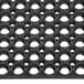 a black plastic mat with holes in it