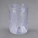 A close-up of a Carlisle clear plastic tumbler with a textured surface.