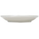 A CAC Garden State bone white porcelain saucer on a white surface.