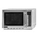 An Amana stainless steel commercial microwave with a glass door.